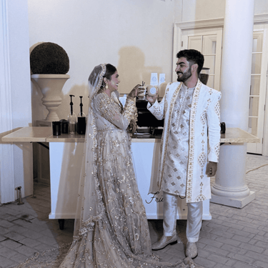Bride and groom toasting with specialty lattes at Dallas wedding with mobile coffee cart catering