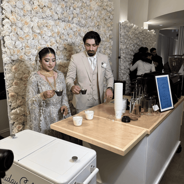 Bride and groom making custom lattes at Friday Coffee Co. mobile coffee cart for Dallas wedding
