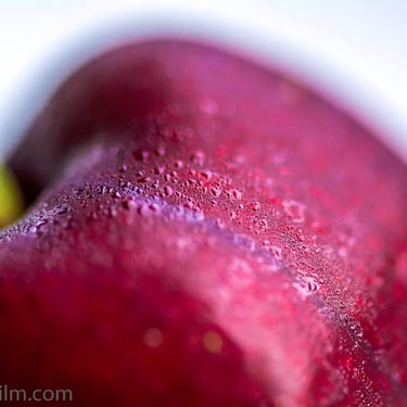 A delicious photograph showing the rich, vivid colour and intricate texture of a luscious red cherry in stunning clarity.