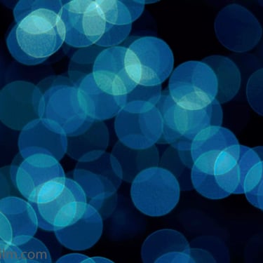 An abstract cold toned photograph featuring out-of-focus night light reflections