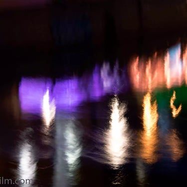 A photograph of blurred multicoloured lights