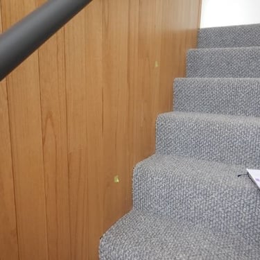 Qualified Perth building inspector reviewing electrical fittings and wall cladding during PCI stage of a new home.