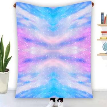 a blanket with a colorful galaxy style