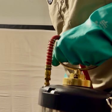 Exterminator on a bed bug treatment application in Menifee Footprint Pest Management