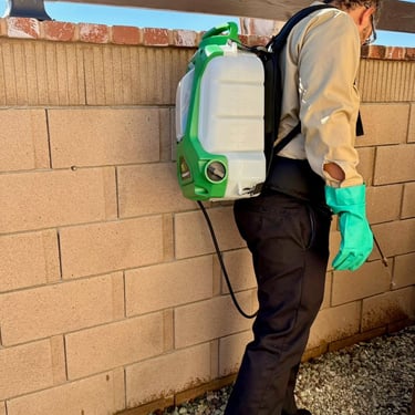 Exterminator on a general pest service exterior treatment Footprint Pest Management