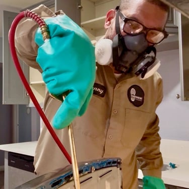 Exterminator on a German roach treatment in Menifee CA Footprint Pest Management