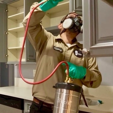 Exterminator on a Cockroach Treatment, inside a kitchen, in Menifee, Footprint Pest Management pest control near me