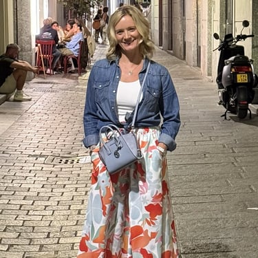 Me wearing a blue denim button down shirt for layering on warm travel days