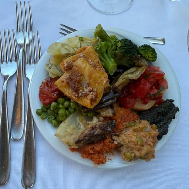 Mixed plate of vegetables and dips served at a winery in Italy