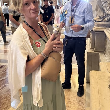 White linen button down shirt shown off the body to highlight its lightweight fabric