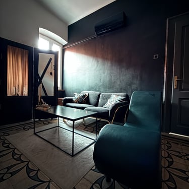 Living-room-with-Tantra-chair-sofa-coffee-table-and-a-mirror-with-a-reflection-of-St-Andrews-cross
