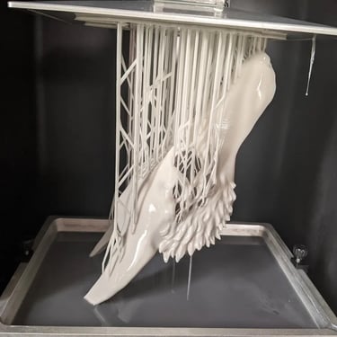 Raw resin BJD parts on supports, demonstrating professional-grade fabrication standards.