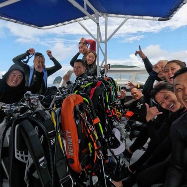 group photo of divers on a boat