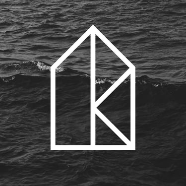 a house with a white house in the middle of the frame