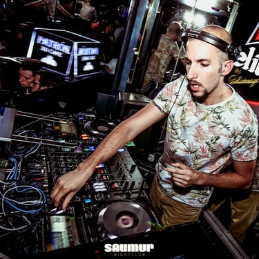 Julien Scalzo, DJ and house music producer, mixing live at Saumur, Luxembourg, creating an electrifying atmosphere.