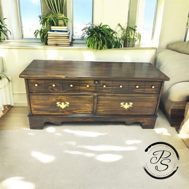walnut stain chest with gold hardware