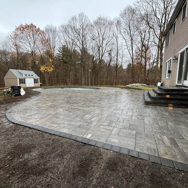 outdoor patio surrounding pool area in North Shore MA
