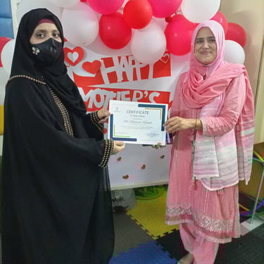 "Delicious slice of red velvet cake topped with cream cheese frosting, served on a white plate."