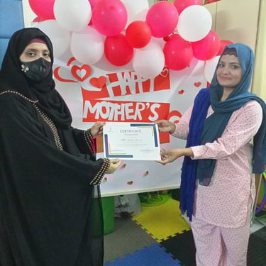 "Delicious chocolate mousse dessert served in a glass, topped with whipped cream and a sprinkle of cocoa."