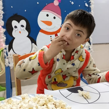 Child experimenting with sensory materials in therapy