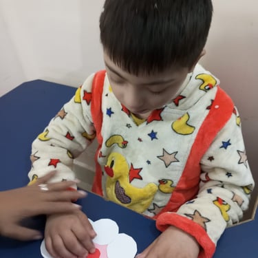 Child interacting with sensory toys during therapy