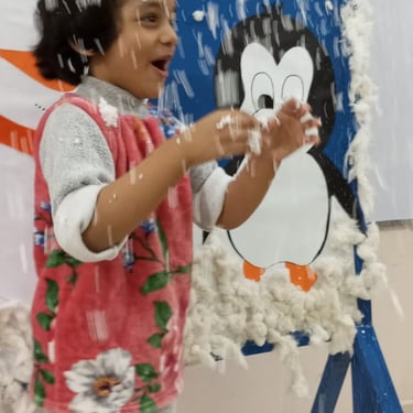 Child enjoying sensory play with colorful materials
