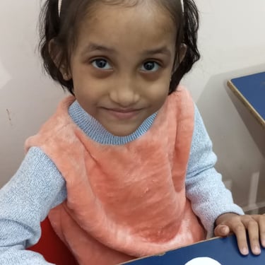 Child interacting with sensory toys during therapy