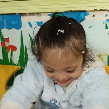 Child involved in hands-on sensory therapy activity