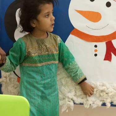 Kids focused on painting and creating art.