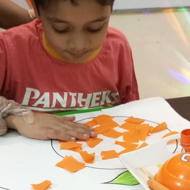 Child focused on creative sensory therapy activity