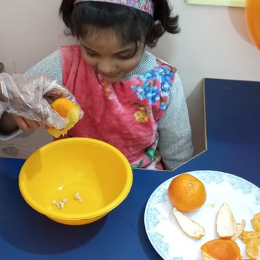 Child interacting with colorful sensory play materials
