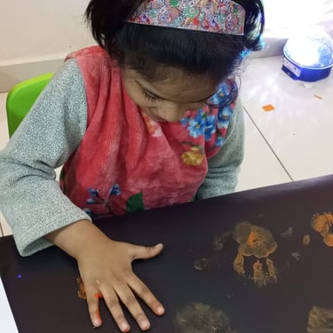 Child exploring sensory toys during therapeutic play