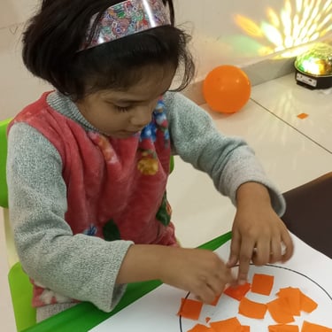 Child focused on creative sensory therapy activity
