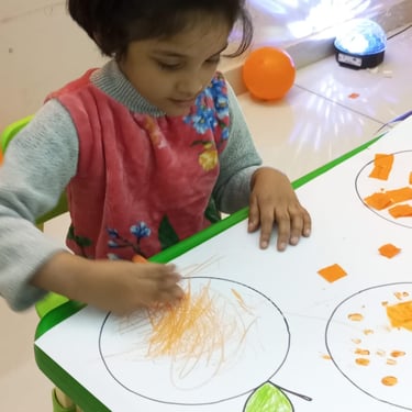 Child enjoying tactile play with sensory materials