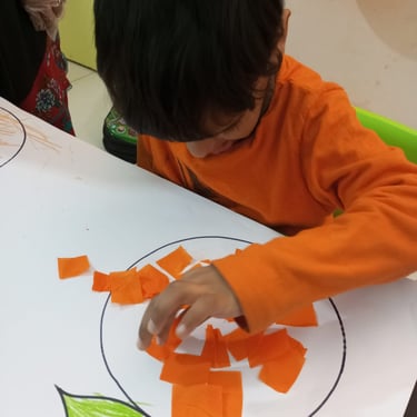 Child focused on creative sensory therapy activity
