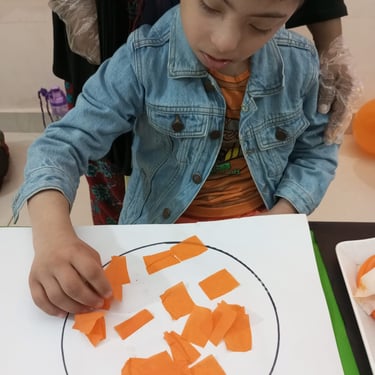 Child focused on creative sensory therapy activity