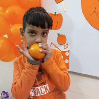 Child engaged in sensory exploration with materials