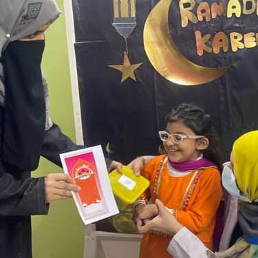 "Close-up of a beautifully decorated cake with intricate icing details and fresh flowers on top."