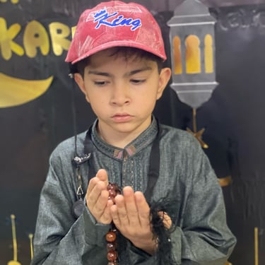 "Close-up of a delicious dessert with layers of cake, cream, and fruit, served on a white plate."
