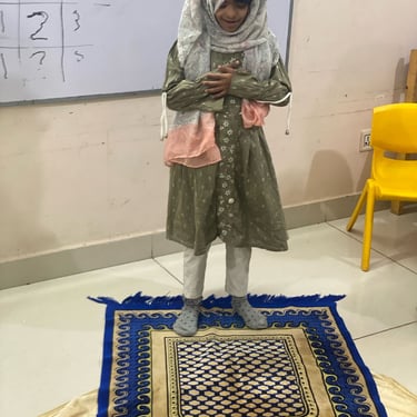 "Decorative table featuring an elegant cake with fresh flowers and assorted desserts, set for a special occasion."