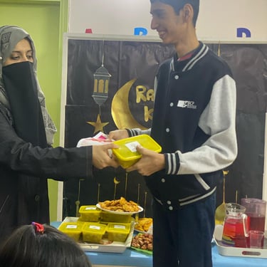 "Colorful fruit platter featuring a variety of sliced fruits, including watermelon, kiwi, and strawberries, arranged on a whi