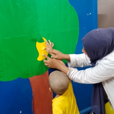 Child focused on stacking blocks during therapy