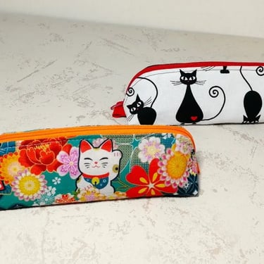 2 trousses à motif chat