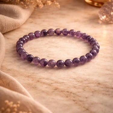 amethyst bracelet 6mm worn on wrist elegant purple gemstone jewelry calm clarity style