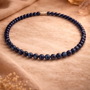 lapis lazuli necklace 6mm with 925 silver clasp deep blue natural stone on marble with warm light