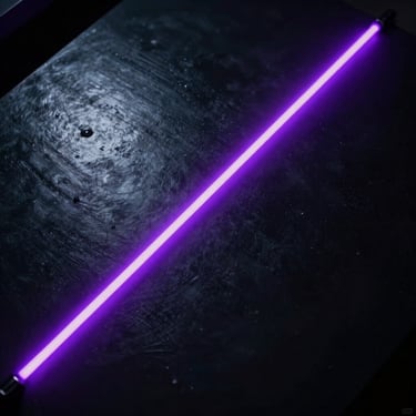 Overhead cinematic shot of a dark reflective surface with a single neon violet beam cutting diagonally across it, fog diffusing the light, deep black negative space, metallic texture catching the glow