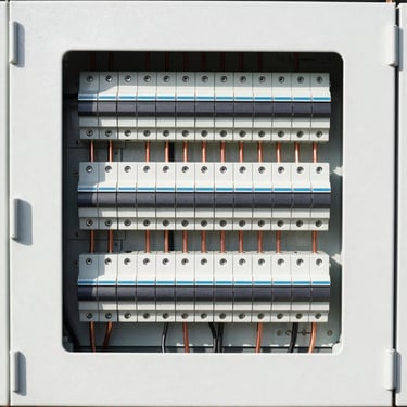 Heavy-duty electrical distribution panel with breakers and copper busbars, clean white background