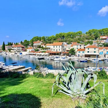 Panoramic view of traditional Dalmatian village of Maslinica, Solta during a SunMarine private boat tour from Split, Croatia.