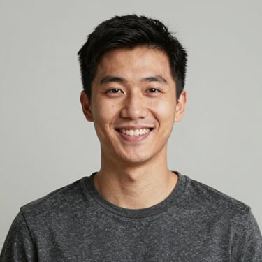 A smiling plumber fixing a kitchen sink with tools in hand.