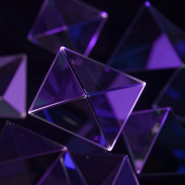 Low-light abstract 3D glass geometries refracting deep indigo and purple light, sharp neon edge-lighting.